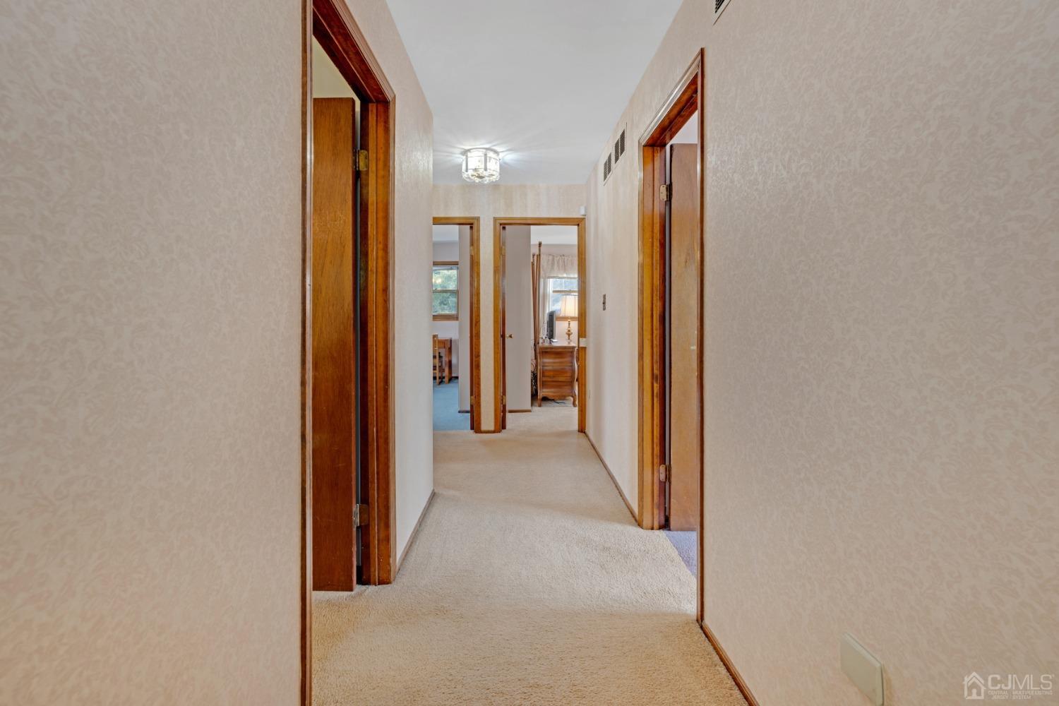 5 Diamond Drive Edison, NJ 08820 - Photo 20 of 35 a view of a hallway with wooden shelves