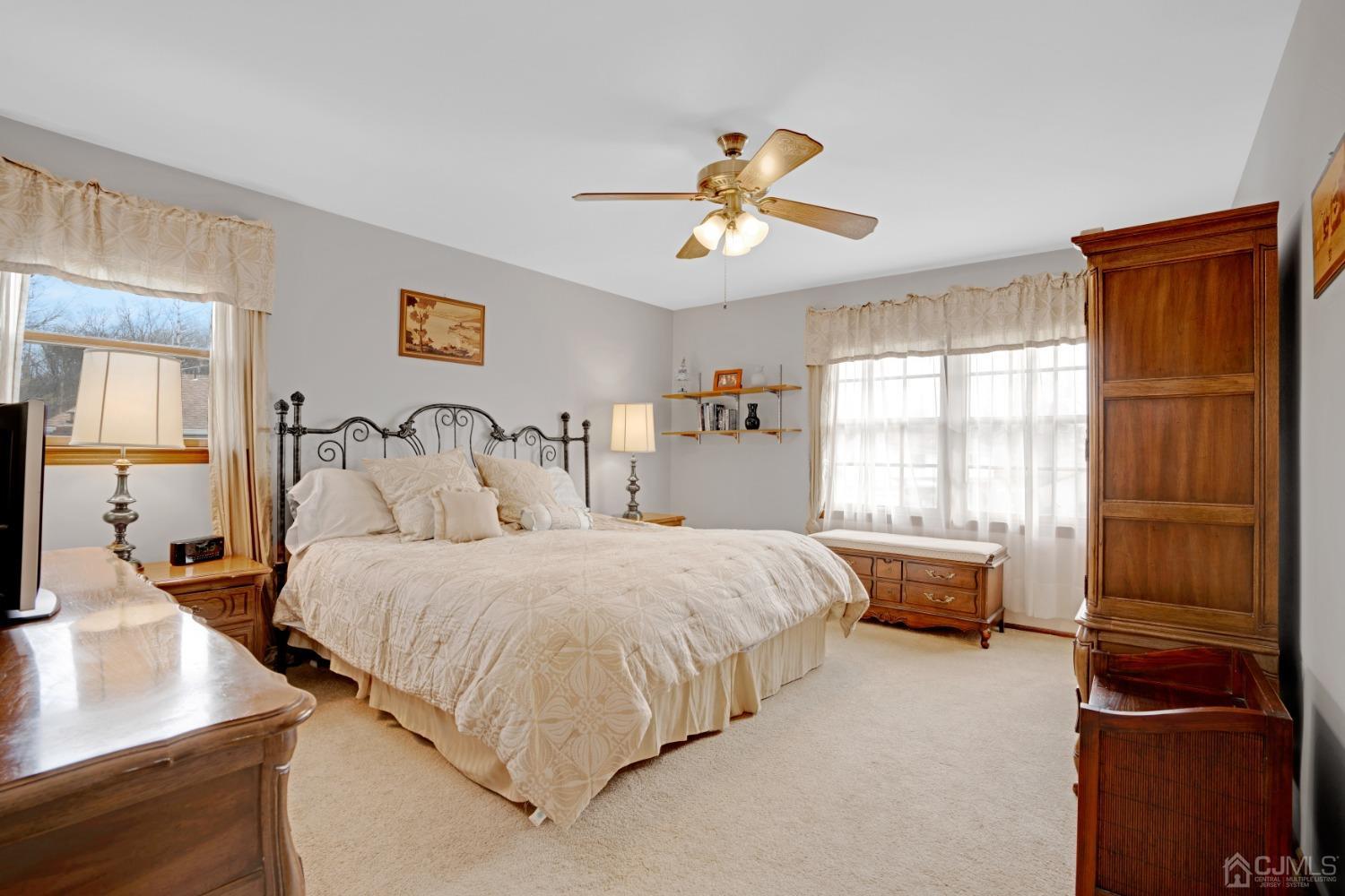 5 Diamond Drive Edison, NJ 08820 - Photo 21 of 35 a bedroom with a bed and a dresser