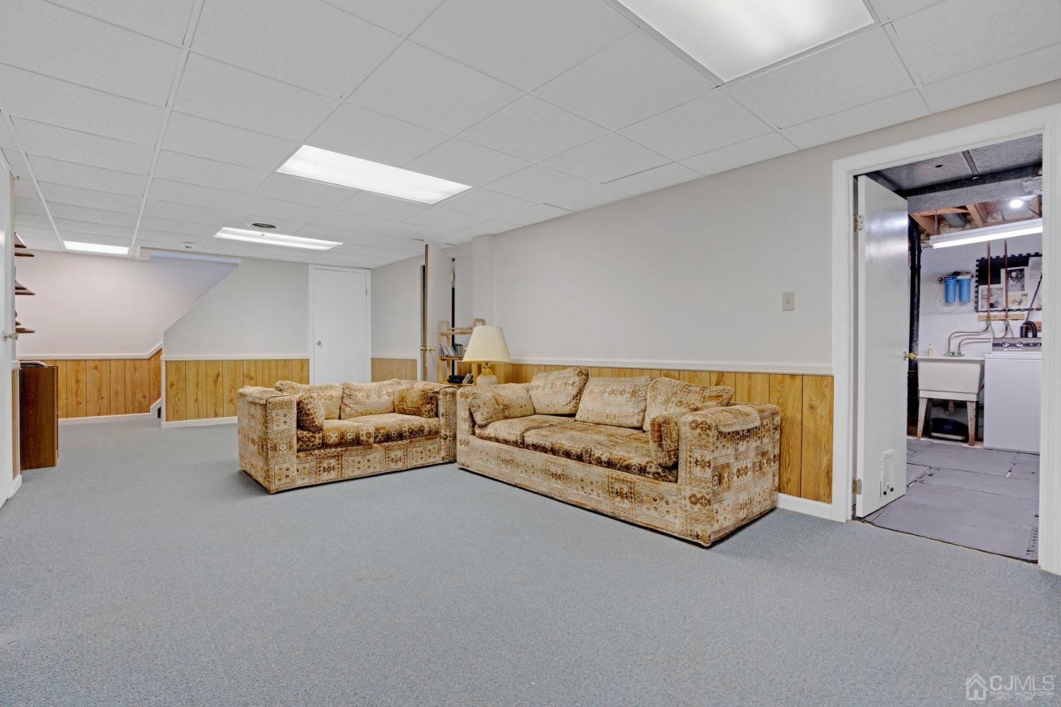 5 Diamond Drive Edison, NJ 08820 - Photo 29 of 35 a living room with furniture and kitchen view
