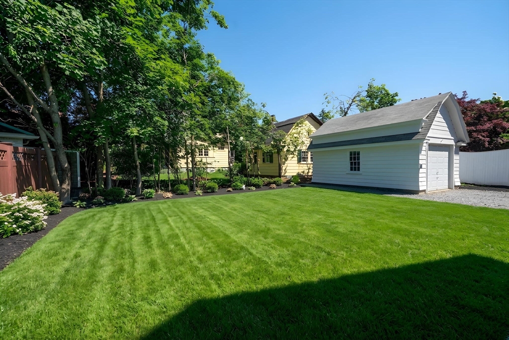 20 Saltonstall Road Medford, MA 02155 - Photo 40 of 41 a view of a backyard with table and chairs and potted plants