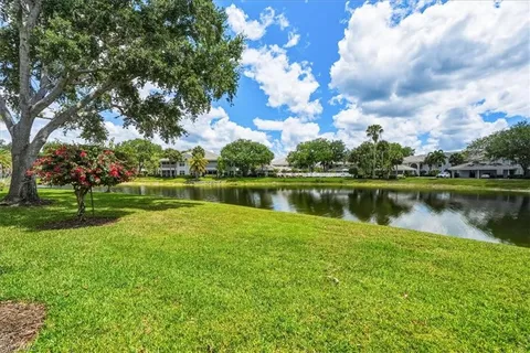a view of a lake with a house in the background