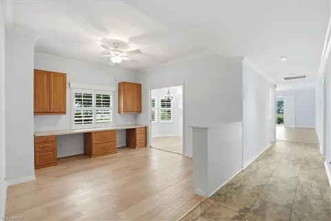 a view of kitchen with stainless steel appliances granite countertop cabinets and wooden floor