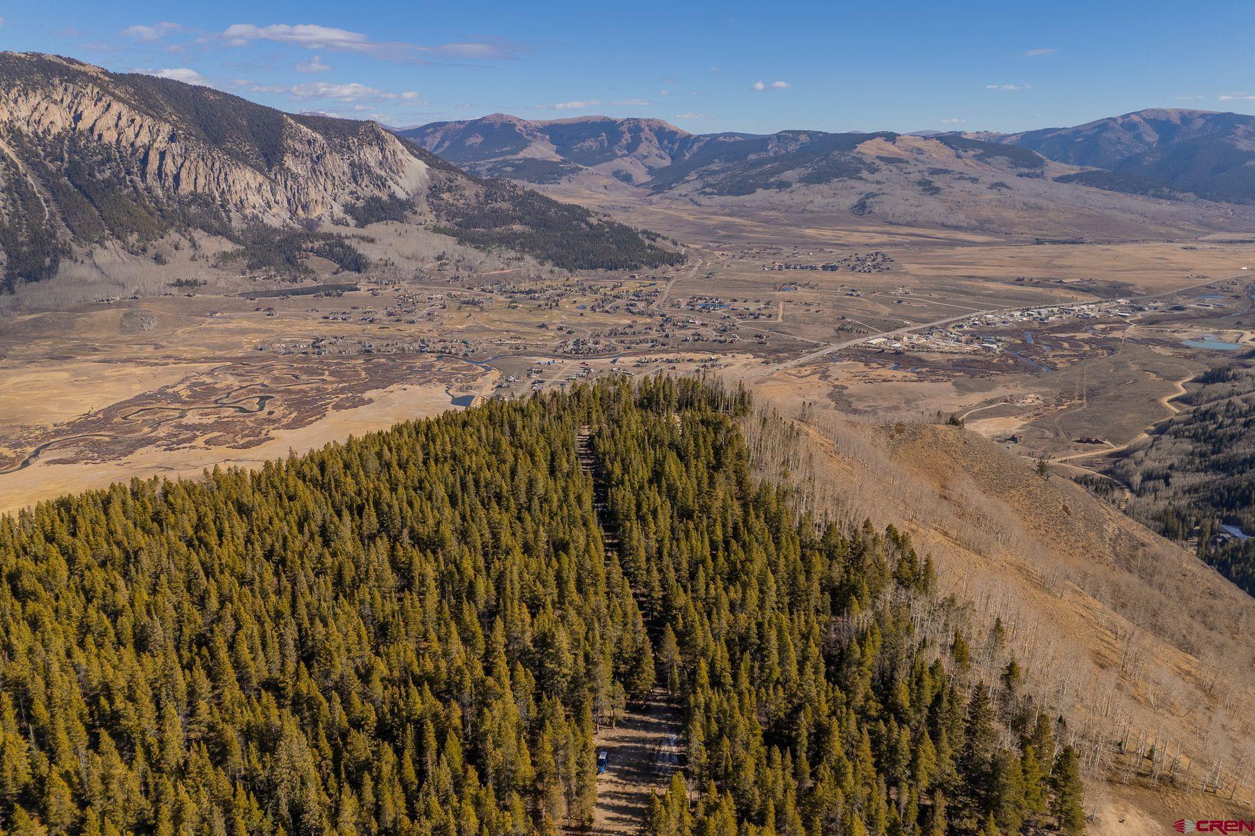 997 Saddle Ridge Road Crested Butte, CO 81224 - Photo 12 of 45 a view of a dry field with mountains in the background