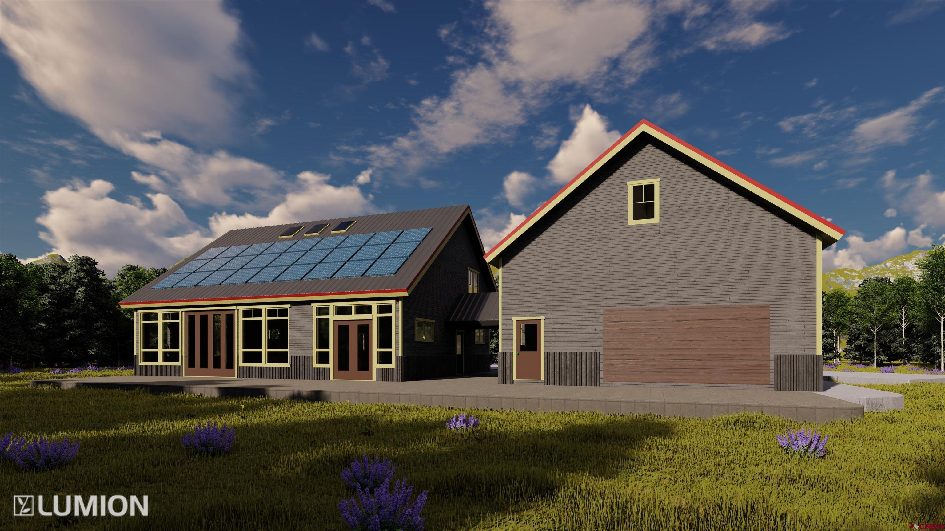 997 Saddle Ridge Road Crested Butte, CO 81224 - Photo 22 of 43 a front view of a house with a garden