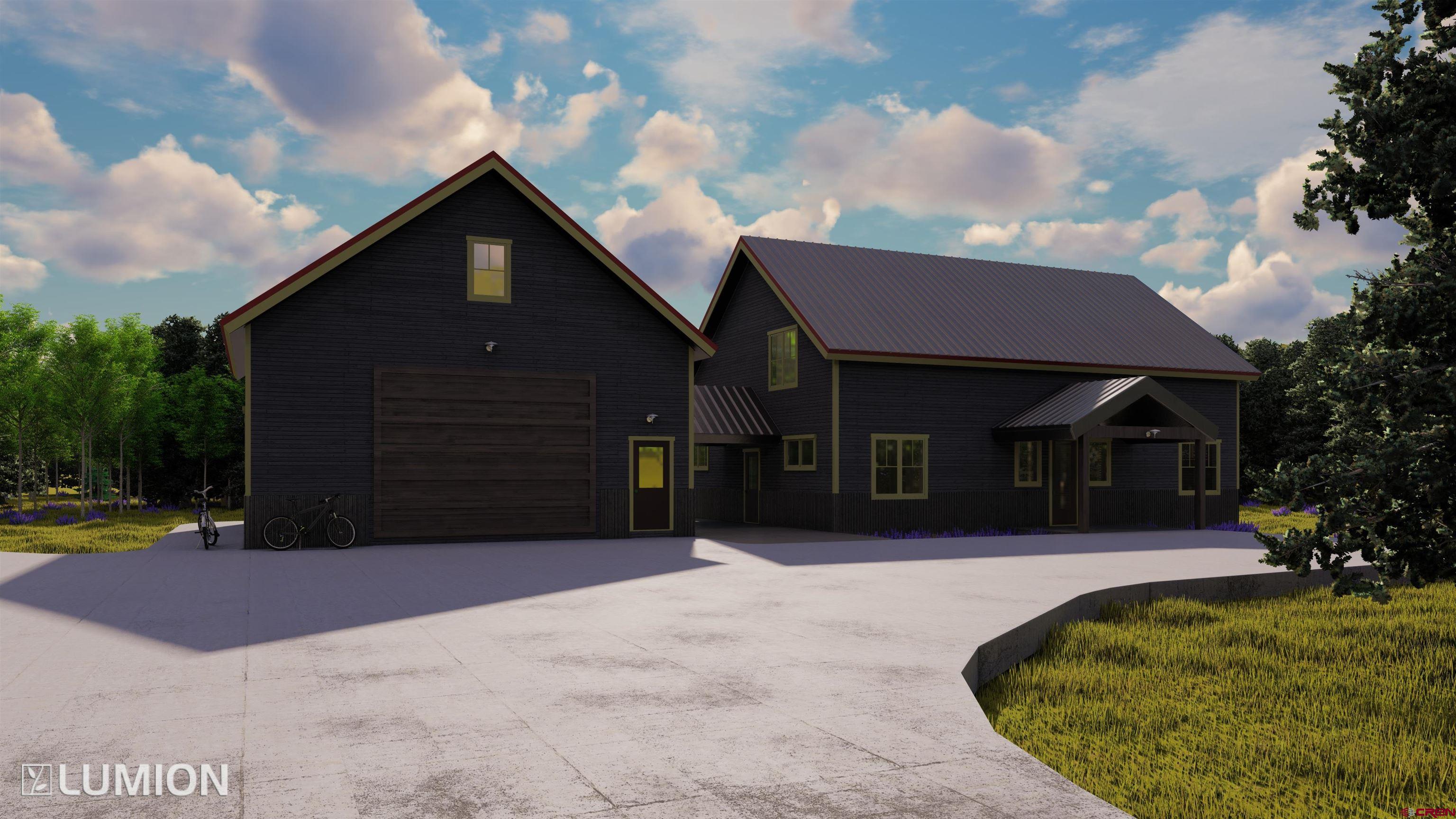 997 Saddle Ridge Road Crested Butte, CO 81224 - Photo 29 of 43 a front view of a house with a yard and garage