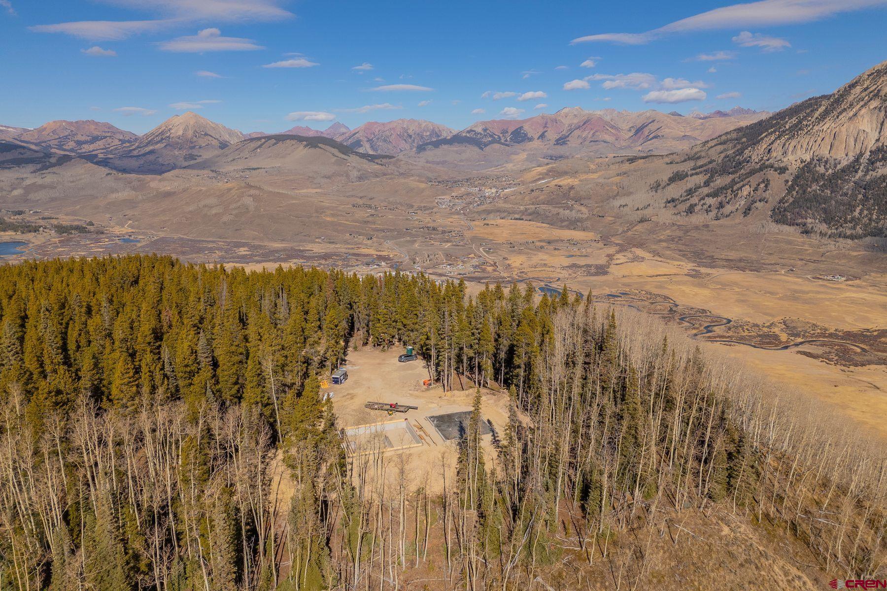 997 Saddle Ridge Road Crested Butte, CO 81224 - Photo 3 of 45 a view of a lake with mountains in the background