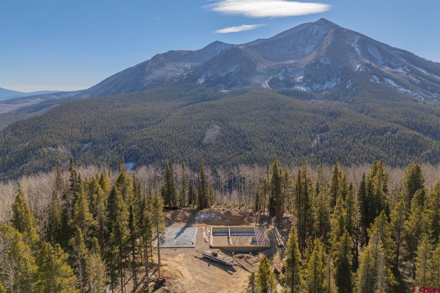 997 Saddle Ridge Road Crested Butte, CO 81224 - Photo 41 of 45 a view of a lake with a mountain in the background