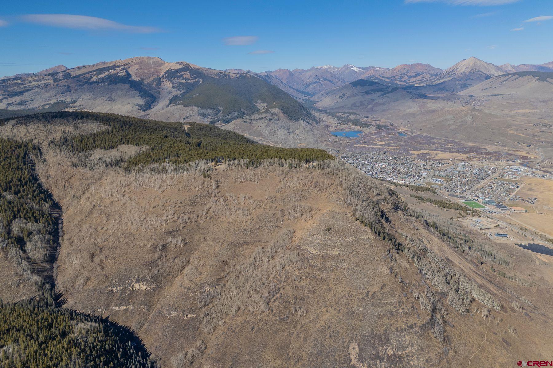 997 Saddle Ridge Road Crested Butte, CO 81224 - Photo 9 of 45 a view of a wooden house with a mountain in the background