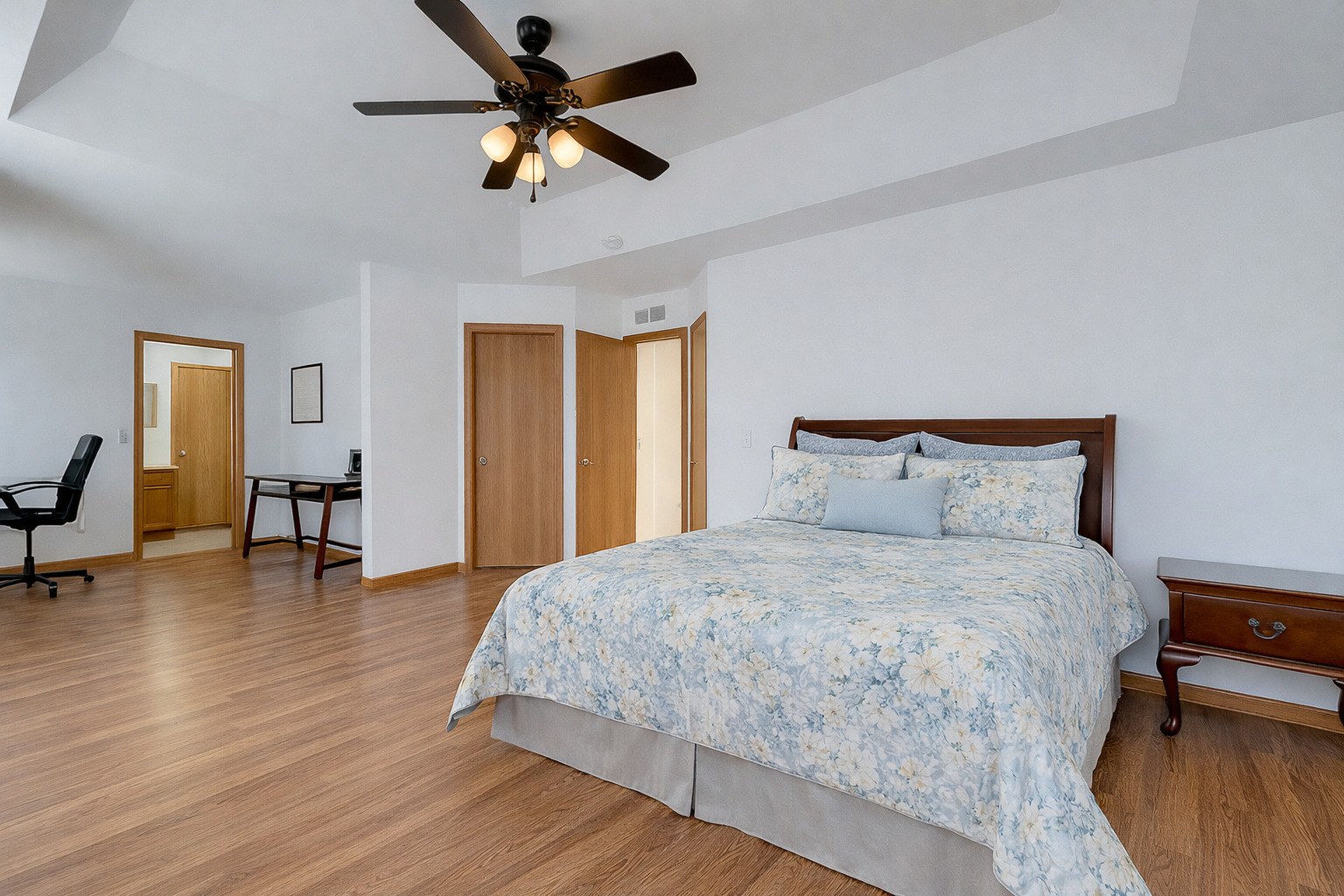 1544 Suncrest Lane Bolingbrook, IL 60490 - Photo 17 of 29 a bedroom with bed and a chandelier