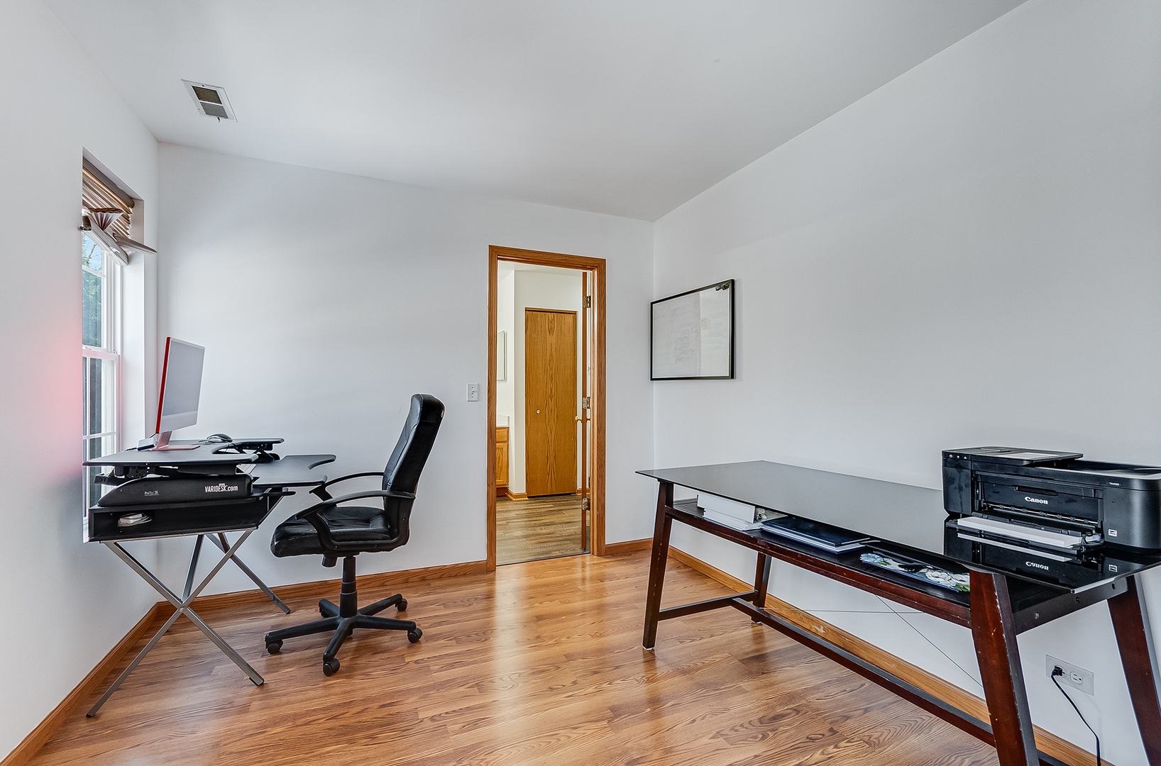 1544 Suncrest Lane Bolingbrook, IL 60490 - Photo 18 of 29 a view of a workspace with furniture and a window
