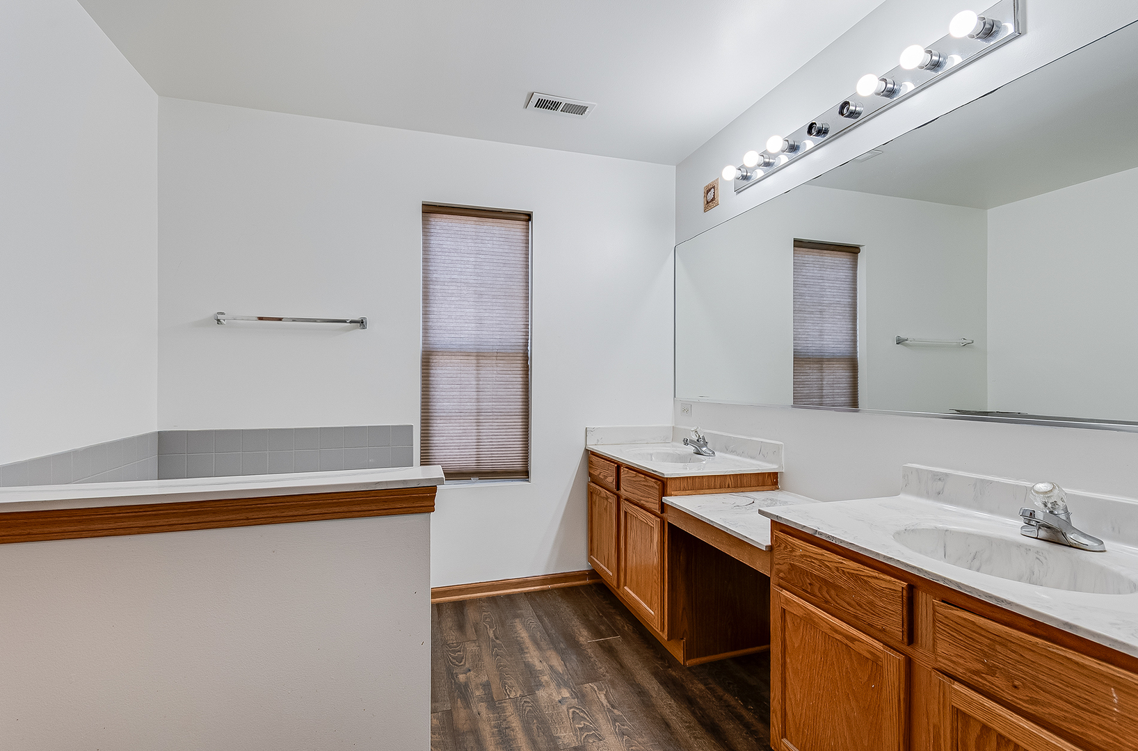1544 Suncrest Lane Bolingbrook, IL 60490 - Photo 19 of 29 a spacious bathroom with a sink double vanity and a mirror