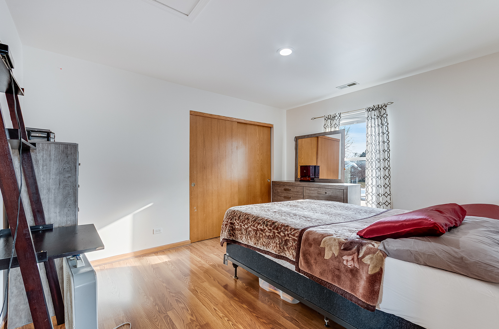 1544 Suncrest Lane Bolingbrook, IL 60490 - Photo 21 of 29 a bedroom with a bed and a flat screen tv