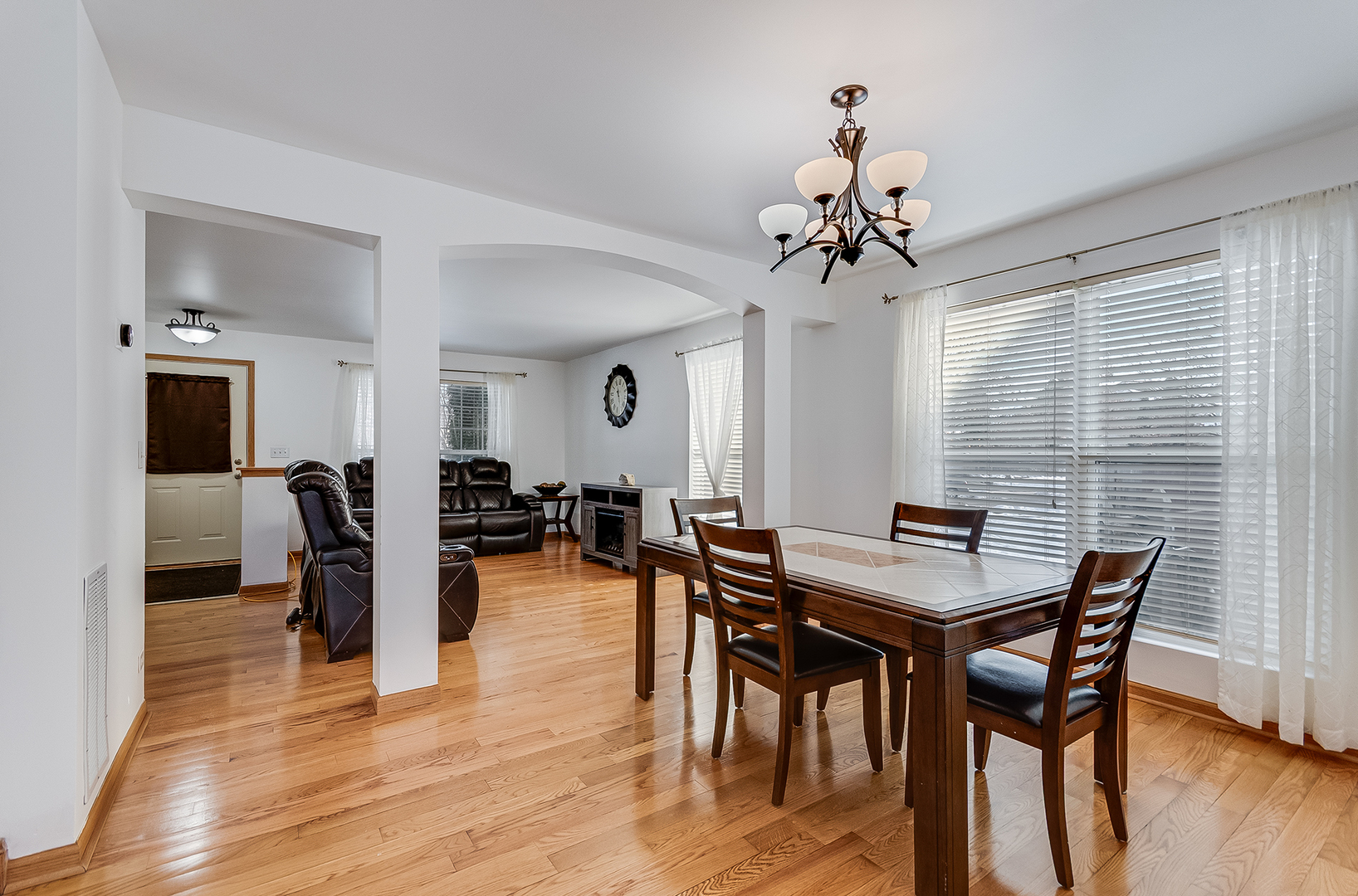 1544 Suncrest Lane Bolingbrook, IL 60490 - Photo 4 of 29 a view of a dining room with furniture and wooden floor