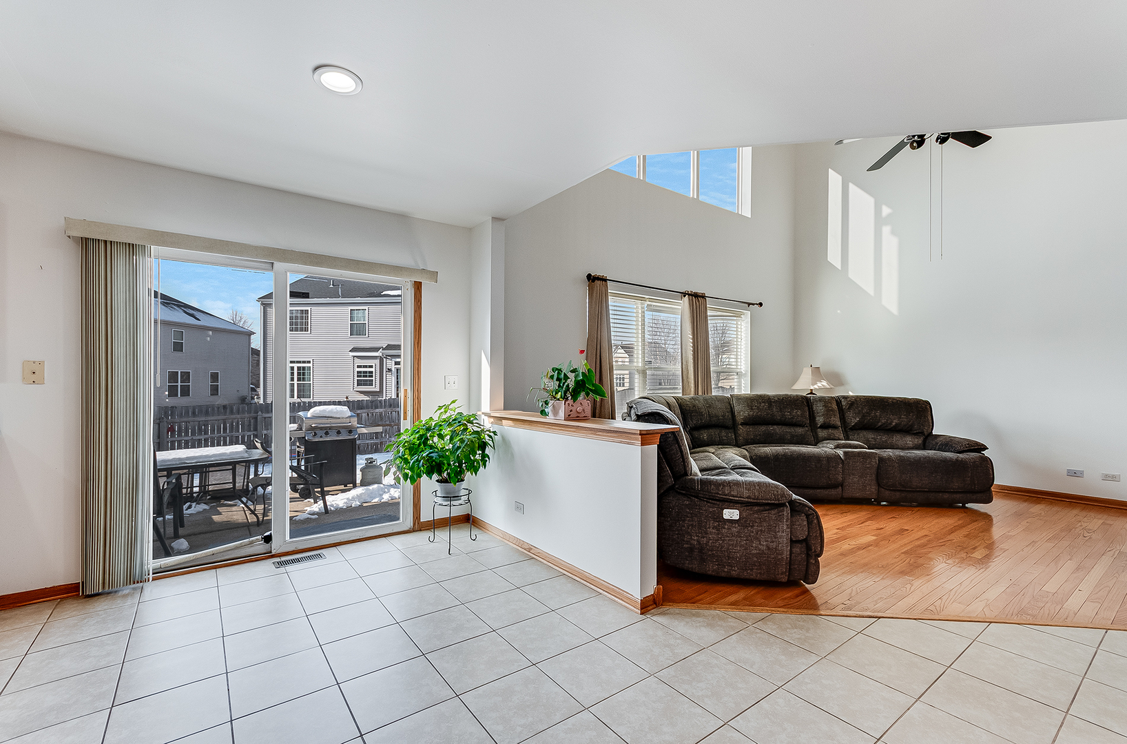1544 Suncrest Lane Bolingbrook, IL 60490 - Photo 8 of 29 a living room with furniture and a flat screen tv