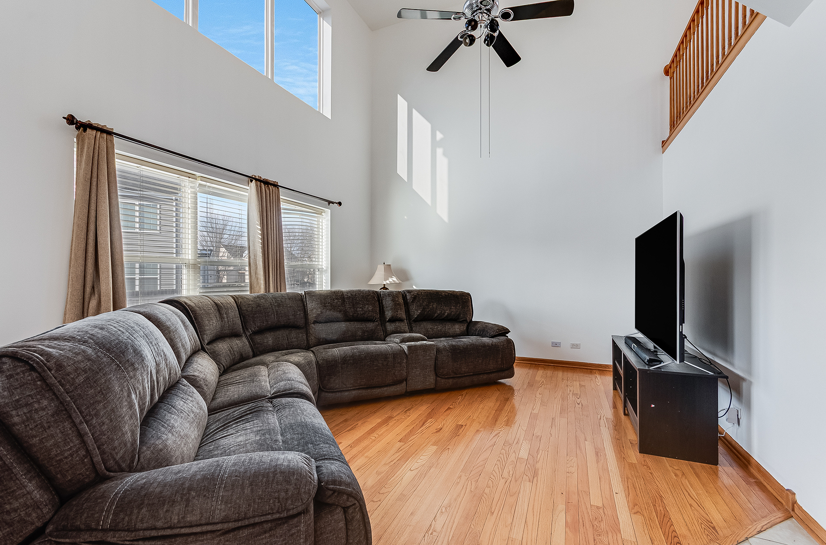 1544 Suncrest Lane Bolingbrook, IL 60490 - Photo 9 of 29 a living room with furniture and a flat screen tv