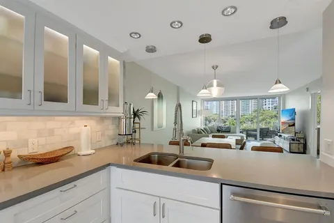a kitchen with lots of counter top space and a sink