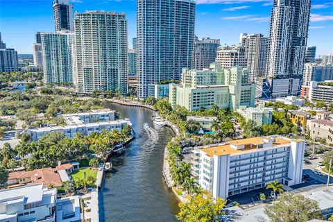 a view of a chairs and table in the city view