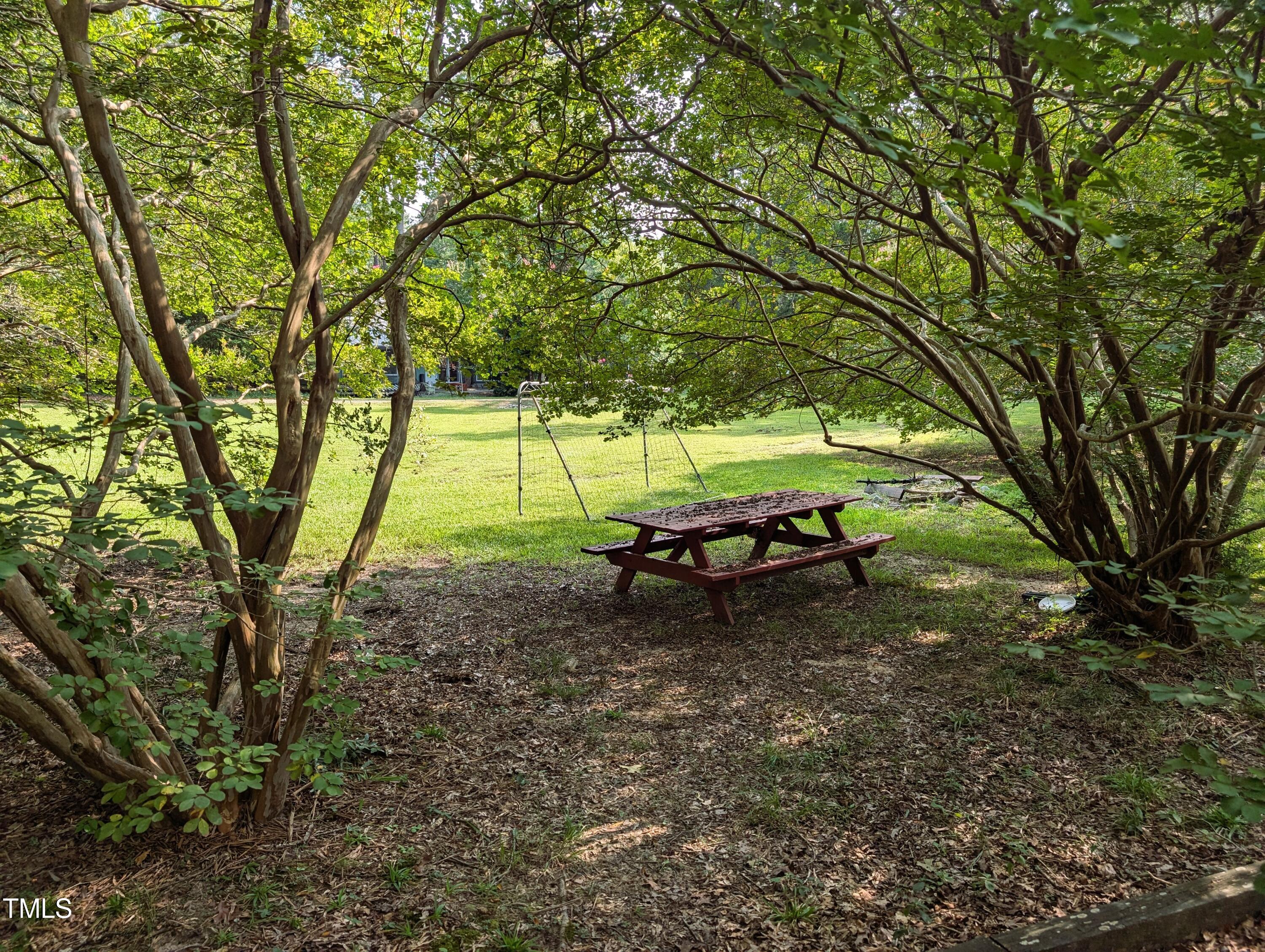 136 Solterra Way Durham, NC 27705 - Photo 7 of 20 a backyard of a house with table and chairs