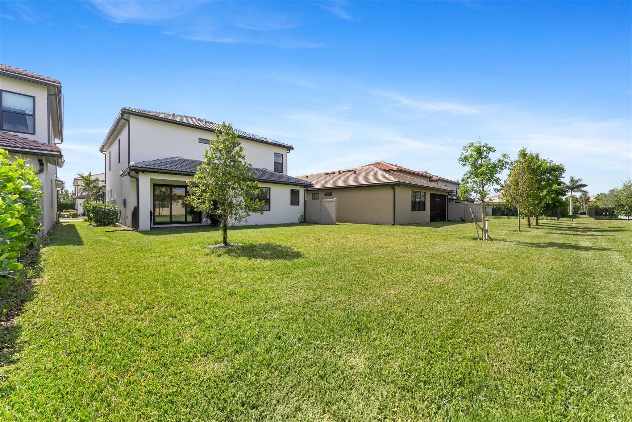 4757 Roldan Court, Unit ROLDAN CT Lake Worth, FL 33467 - Photo 35 of 37 a front view of a house with a yard
