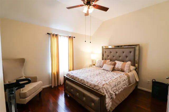 a bedroom with a bed and a couch