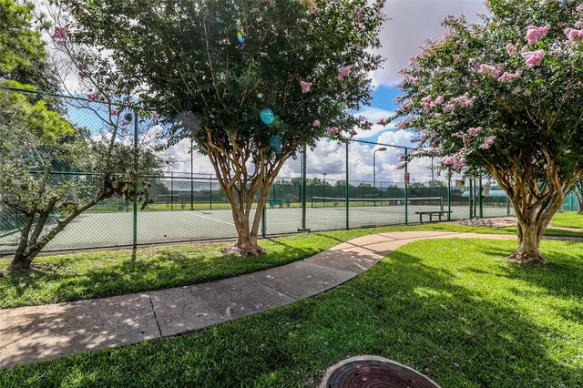 a view of a house with a wooden deck