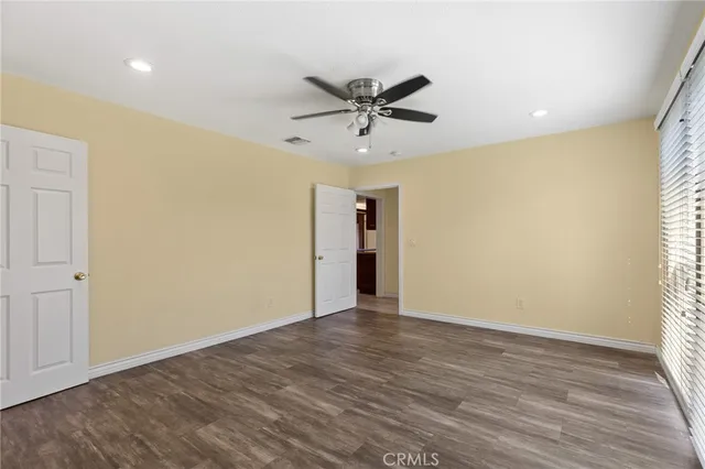 a view of backyard with outdoor seating and plants