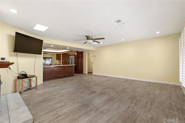 a view of a livingroom with furniture and a flat screen tv