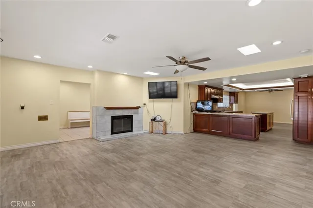 a view of a kitchen with a sink and a fireplace