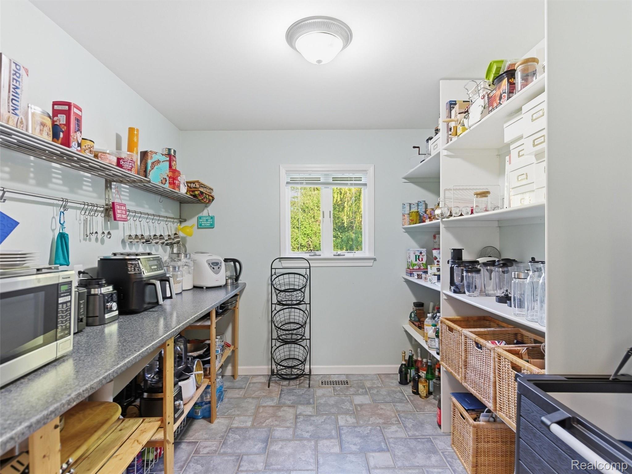 1185 Avon Circle West Rochester, MI 48309 - Photo 20 of 74 Huge pantry perfect for all of your appliances, mini fridge and more!