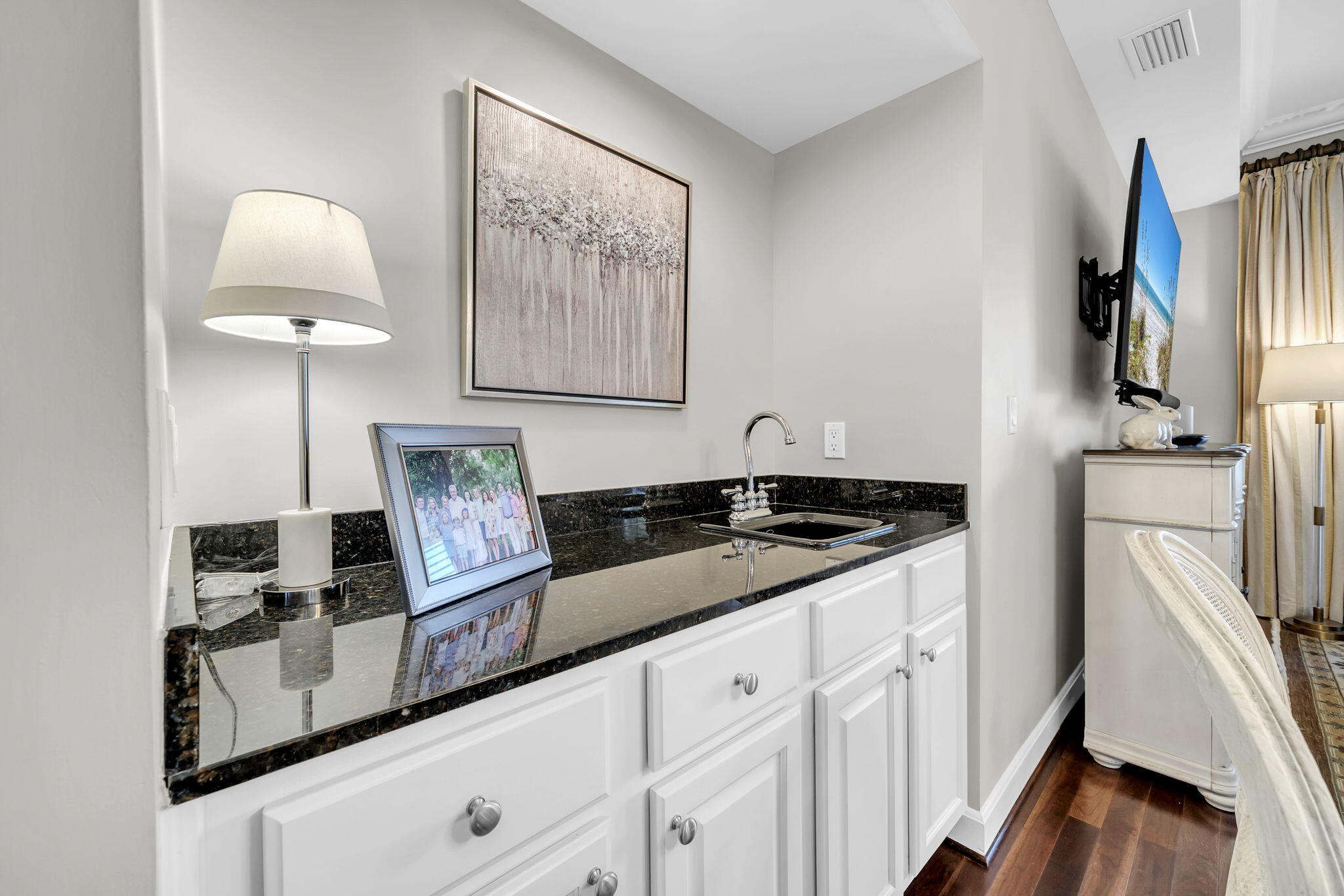 5360 Pine Ridge Lane, Unit 5360 Miramar Beach, FL 32550 - Photo 13 of 44 a kitchen with granite countertop a sink cabinets and stainless steel appliances