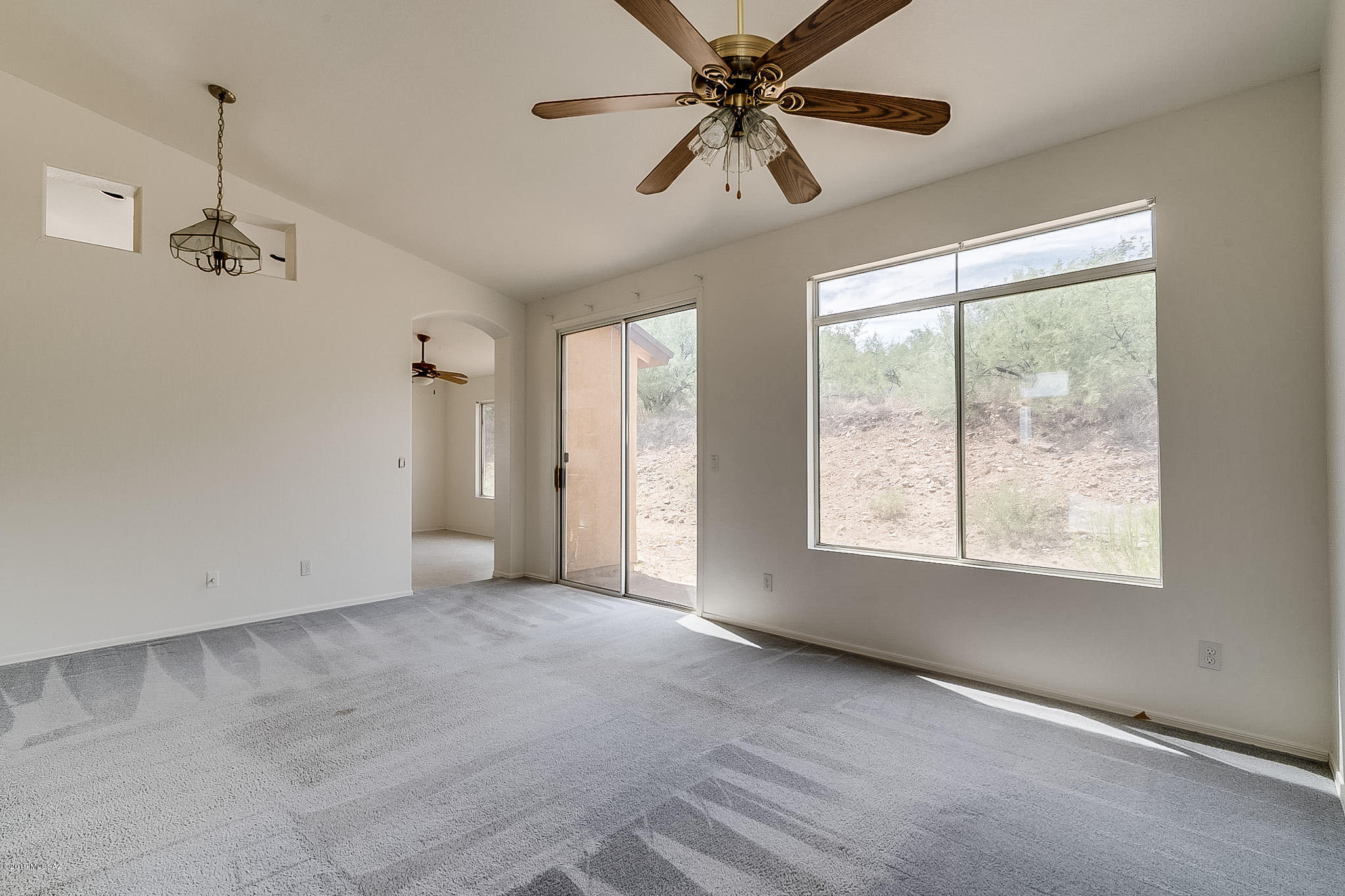 410 Wrightson Street Rio Rico, AZ 85648 - Photo 5 of 50 a view of an empty room with a window