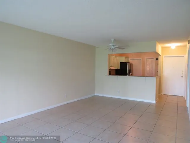 a view of a kitchen with a dishwasher and a refrigerator
