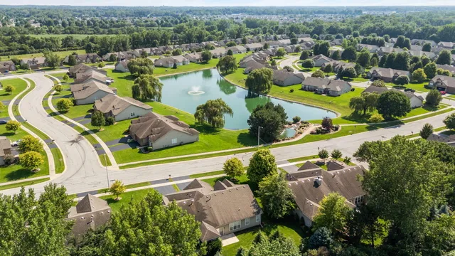 an aerial view of a house with a lake view