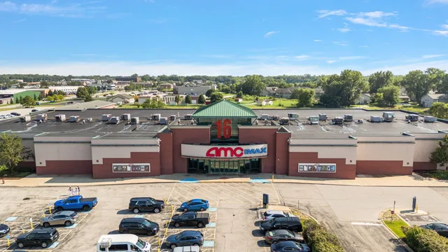 a outdoor view of a building with swimming pool and outdoor seating