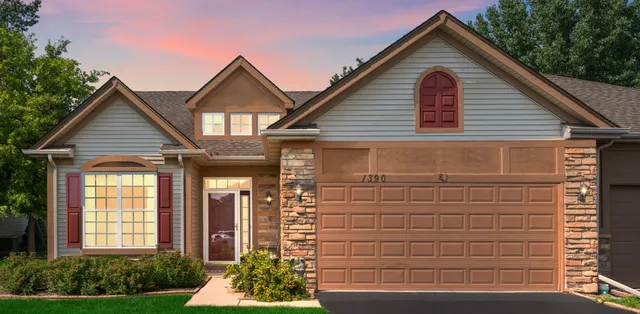 a view of house with garage