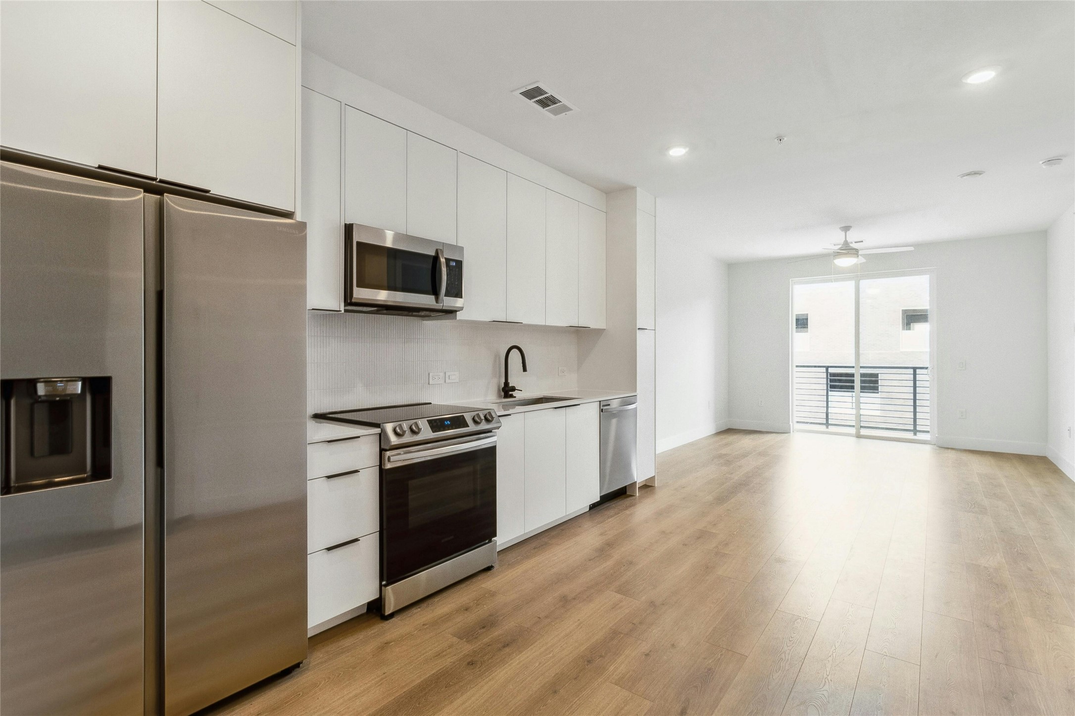 1701 Simond Avenue, Unit 401 Austin, TX 78723 - Photo 16 of 19 Open floor plan condo with a lot of natural light