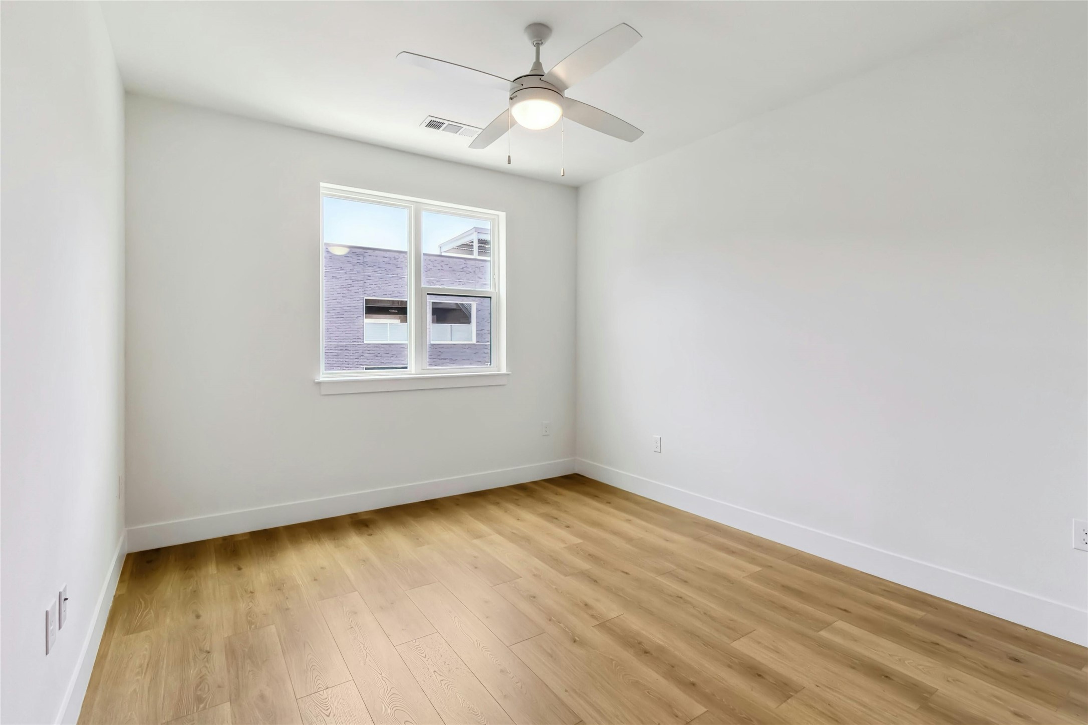1701 Simond Avenue, Unit 401 Austin, TX 78723 - Photo 7 of 19 Spacious bedroom with ceiling fan