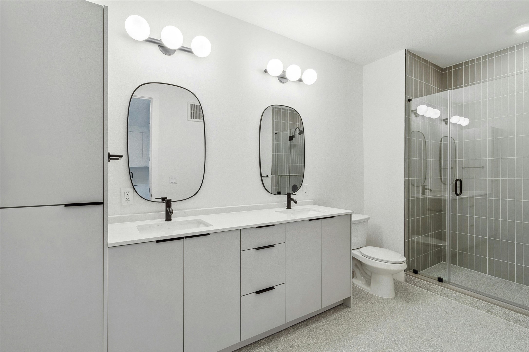 1701 Simond Avenue, Unit 401 Austin, TX 78723 - Photo 10 of 19 Dual-sink vanity with ample storage