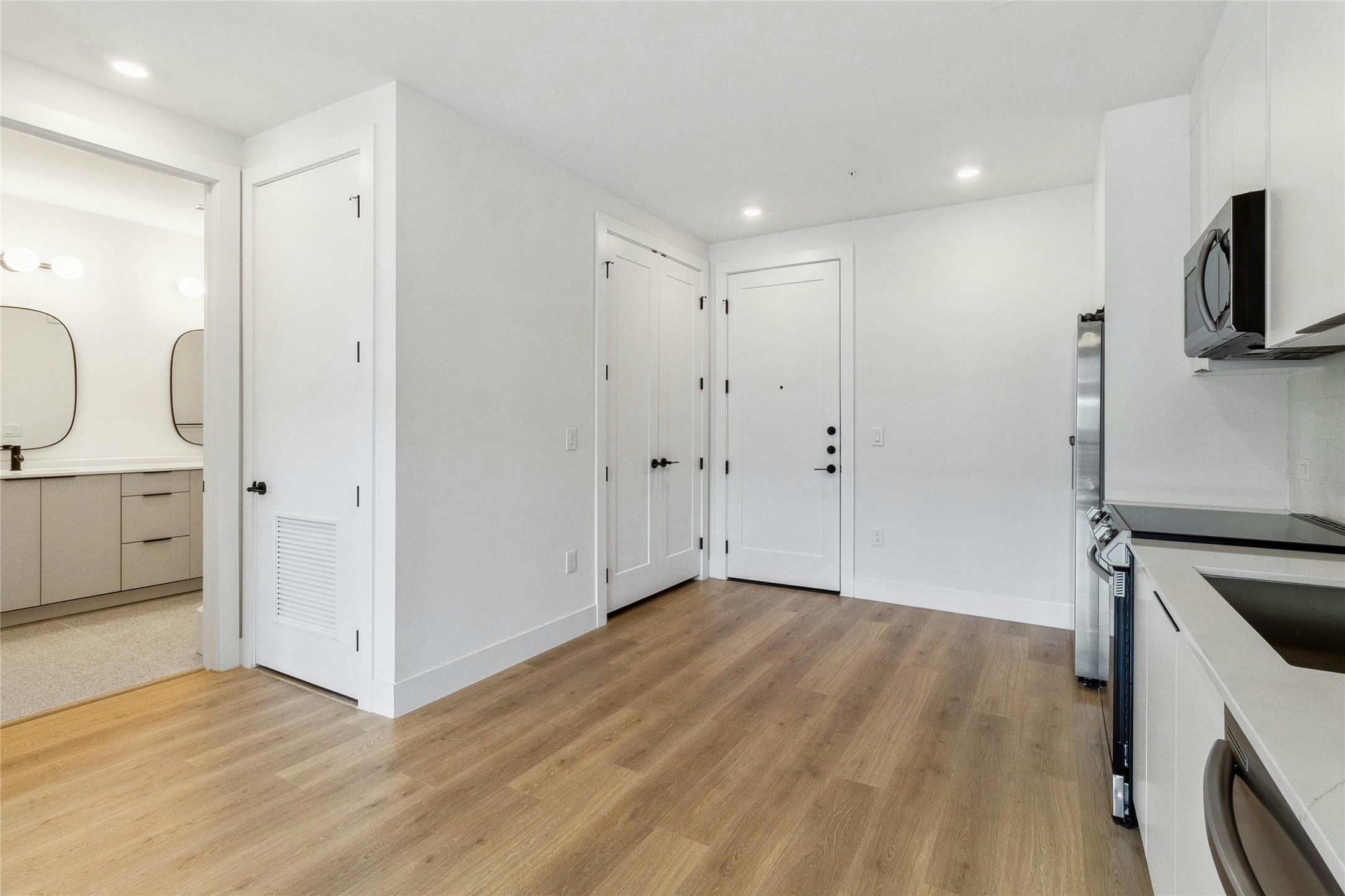 1701 Simond Avenue, Unit 401 Austin, TX 78723 - Photo 17 of 19 Open floor-plan kitchen, with access to laundry and bathroom