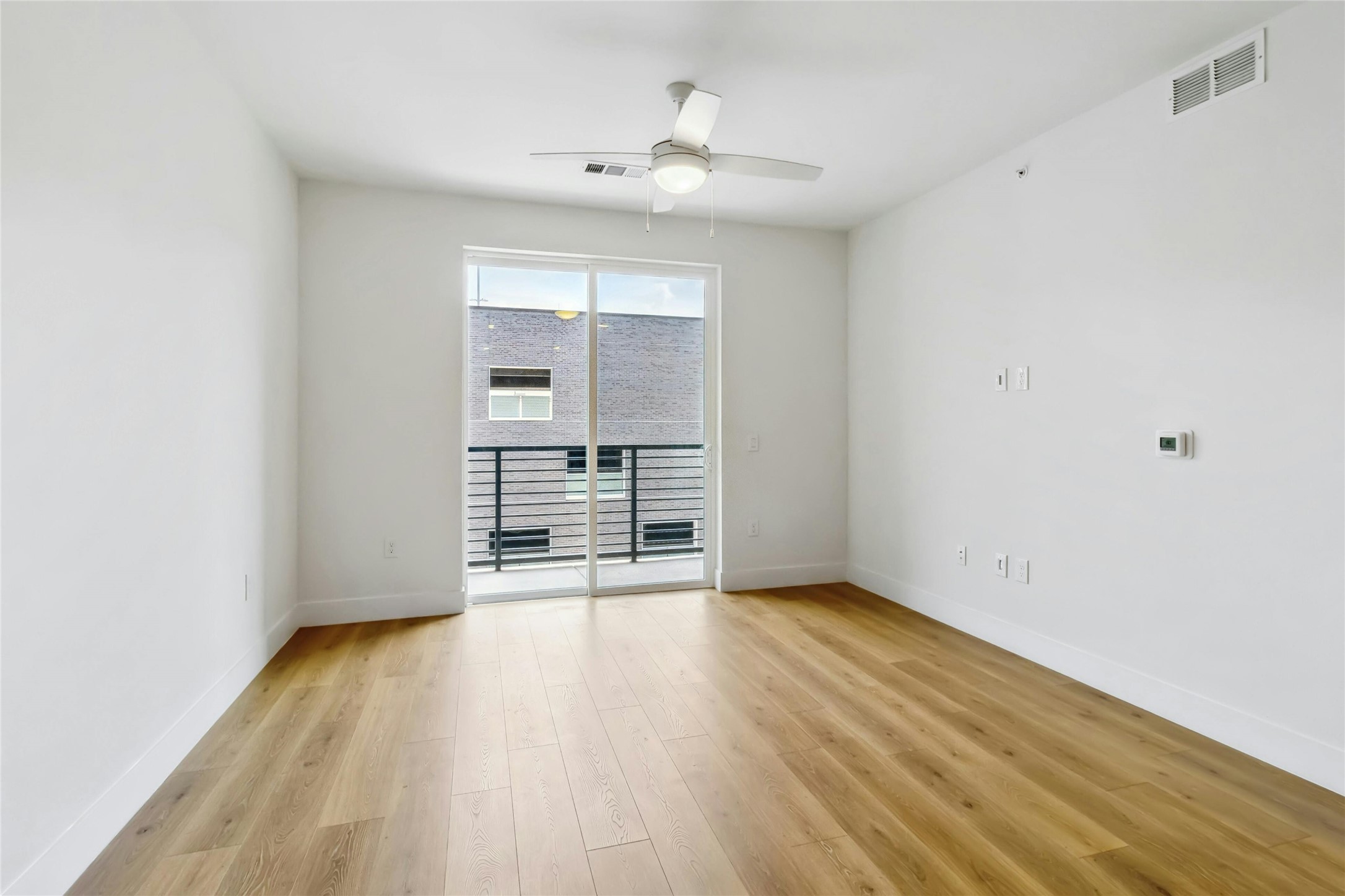 1701 Simond Avenue, Unit 401 Austin, TX 78723 - Photo 4 of 19 Living room opens onto a private balcony