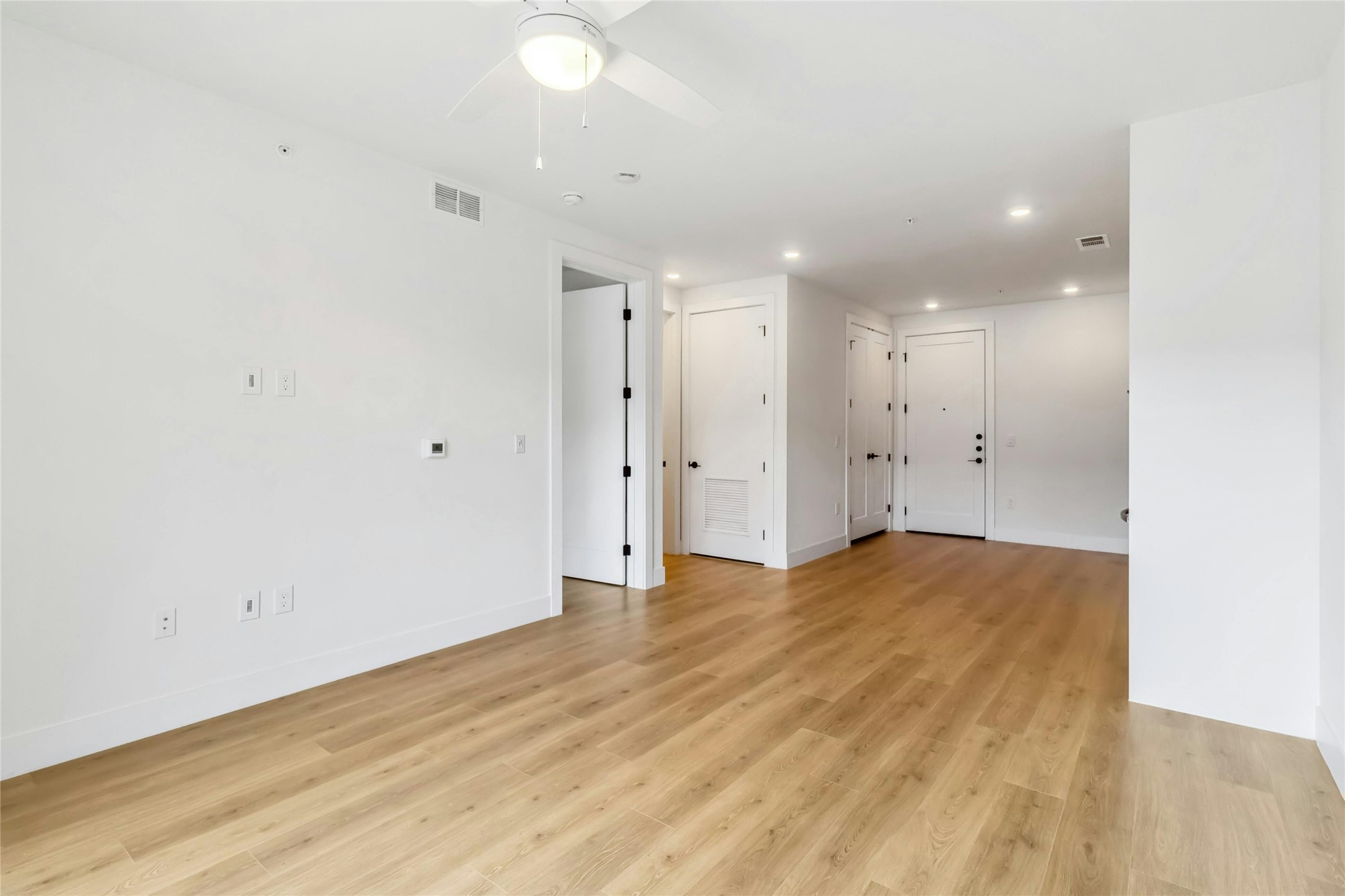 1701 Simond Avenue, Unit 401 Austin, TX 78723 - Photo 6 of 19 Living room is open to the kitchen