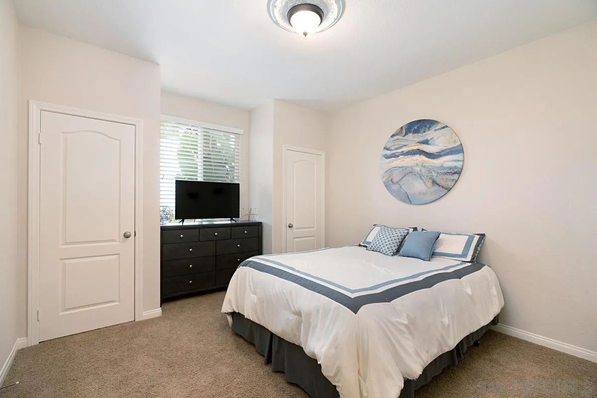 10689 Laurel Path Escondido, CA 92026 - Photo 17 of 48 a bedroom with a bed and a television