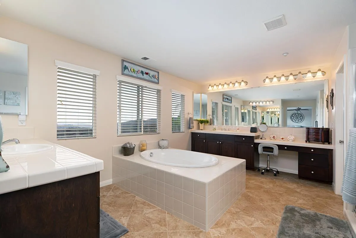 10689 Laurel Path Escondido, CA 92026 - Photo 22 of 48 a large bathroom with a large tub and sink