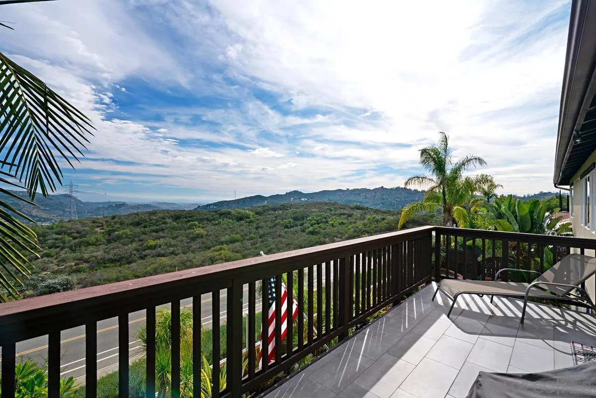 10689 Laurel Path Escondido, CA 92026 - Photo 24 of 48 a view of a balcony with wooden floor next to a yard