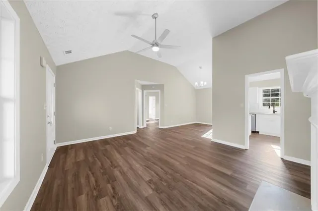 a kitchen with stainless steel appliances granite countertop a sink stove and microwave