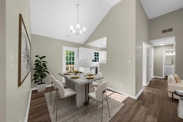 a kitchen with stainless steel appliances granite countertop a sink stove and microwave