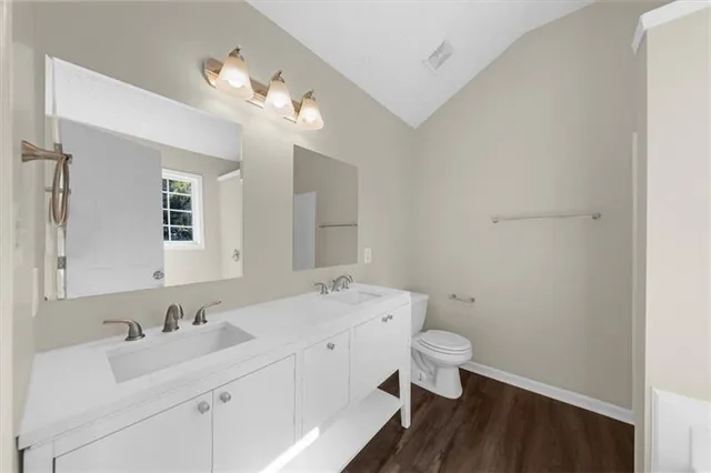 a view of a kitchen with a oven cabinets and a window