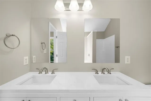 a large kitchen with kitchen island a sink stainless steel appliances and cabinets