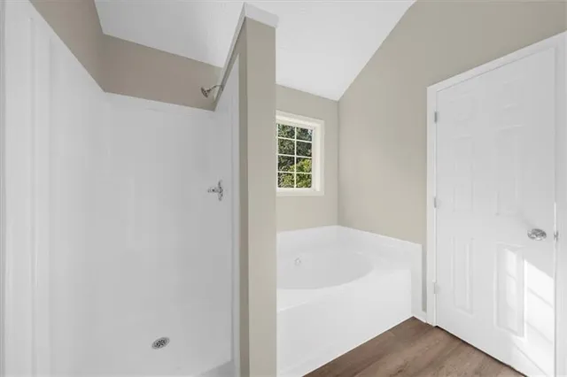 a kitchen with granite countertop white cabinets and a stove