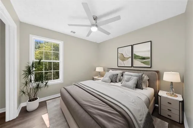 a view of a small space with wooden floor and a window